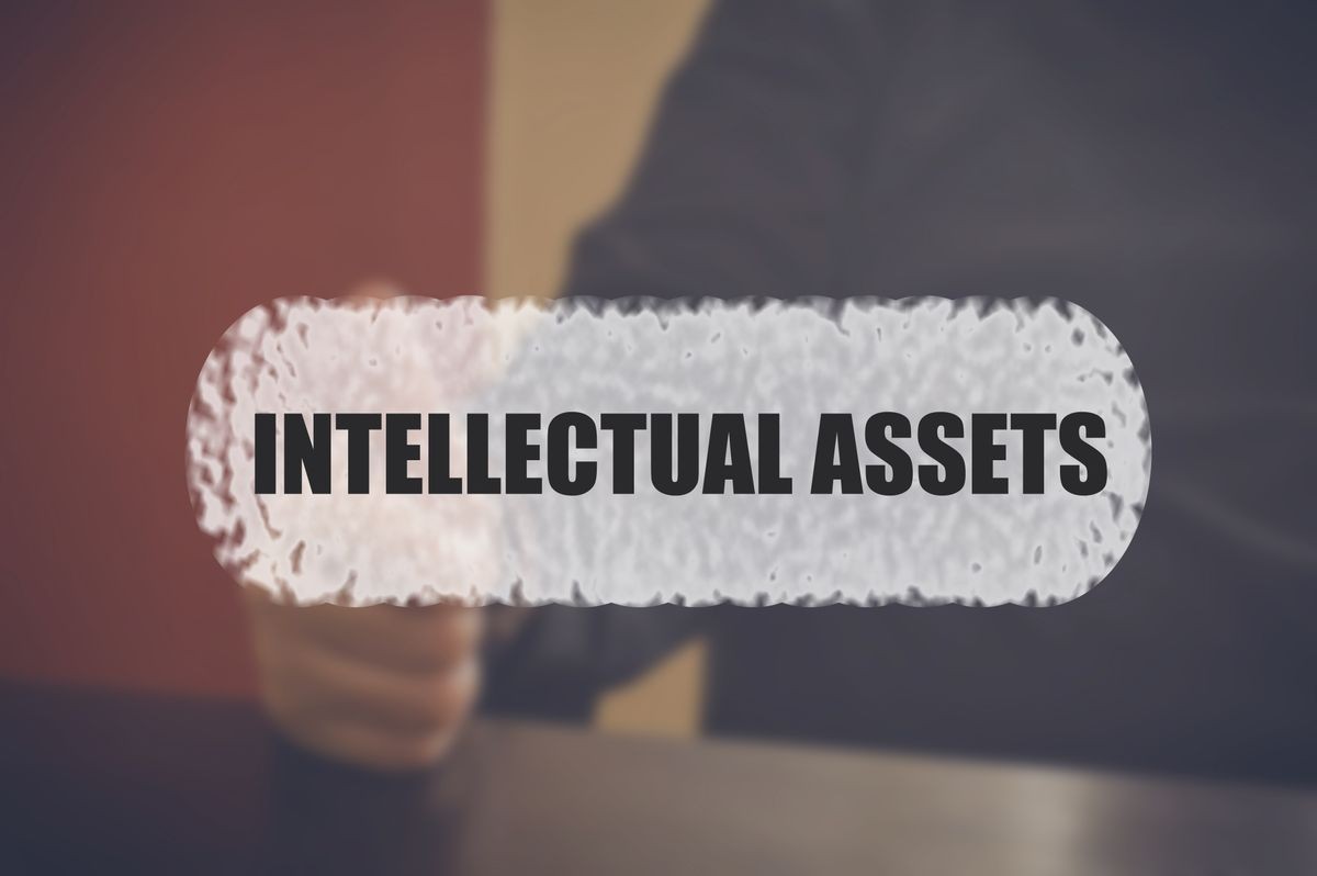 Intellectual assets word with blurring business background